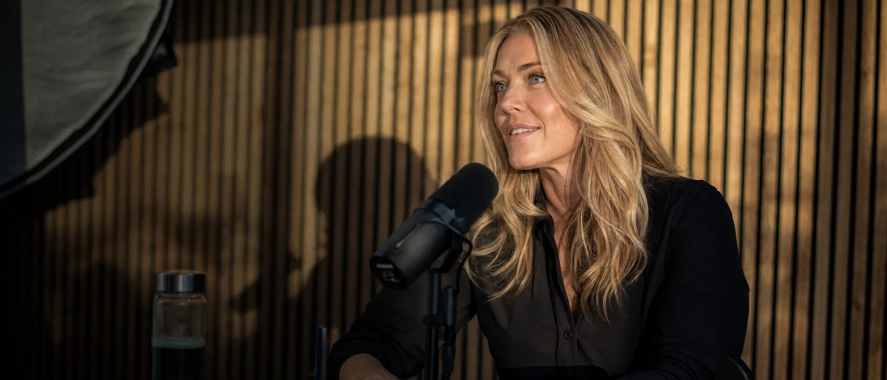 Woman speaking into a microphone